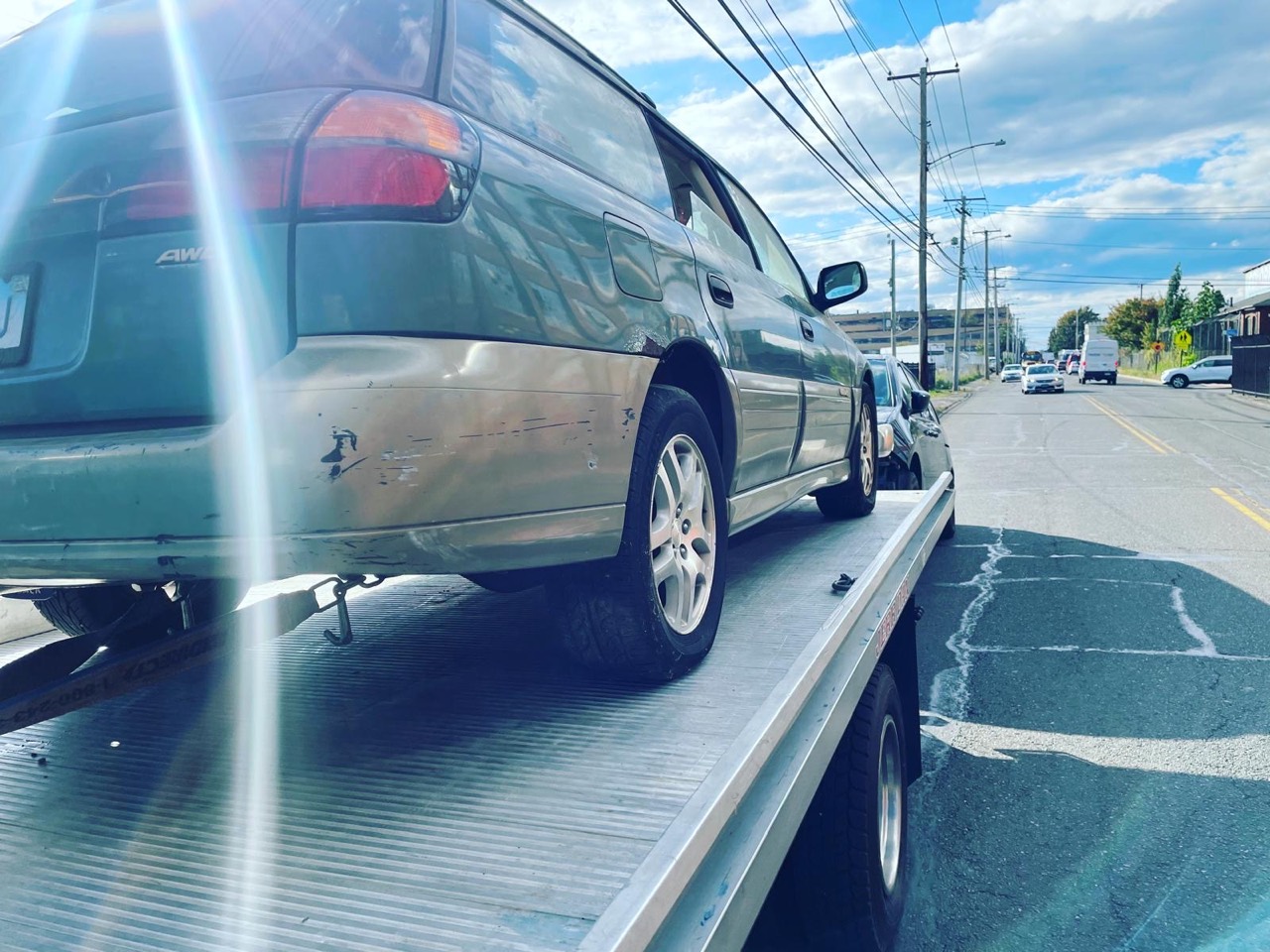 Vehicle secured on a flatbed carrier deck
