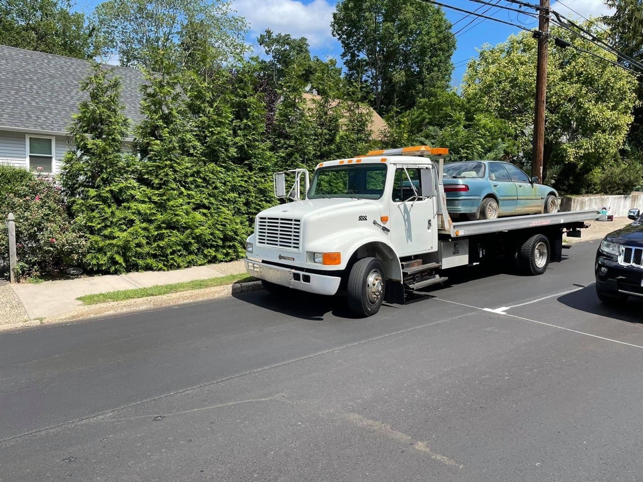 Flatbed carrier transporting a wagon in Connecticut