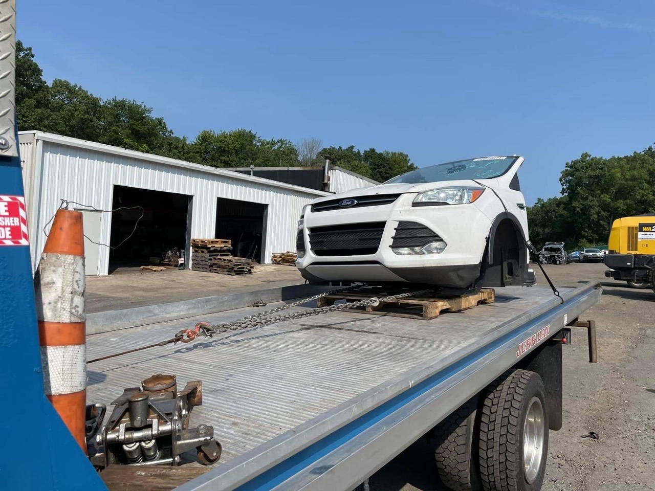 Salvage SUV secured on a flatbed truck