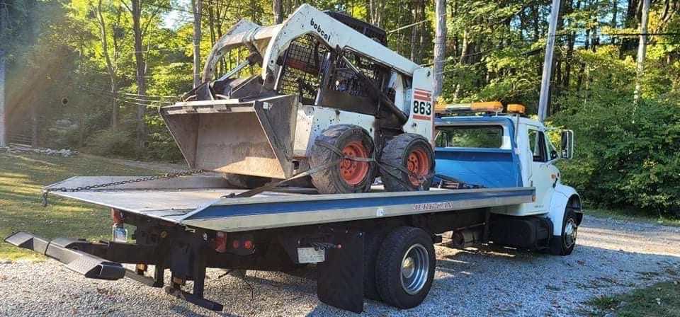 Skid steer loaded on a flatbed truck